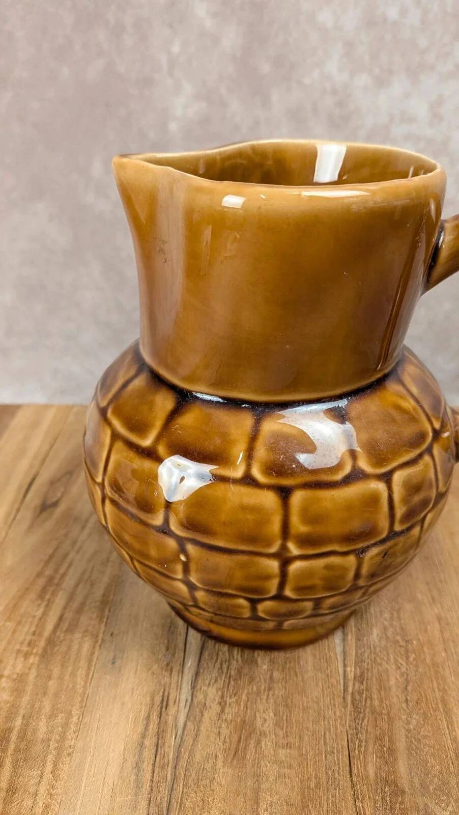 Vintage Sarreguemines pitcher with brown relief decoration.