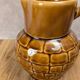 Vintage Sarreguemines pitcher with brown relief decoration.
