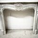 Louis XV style fireplace in veined white marble, 20th century.