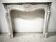 Louis XV style fireplace in veined white marble, 20th century.