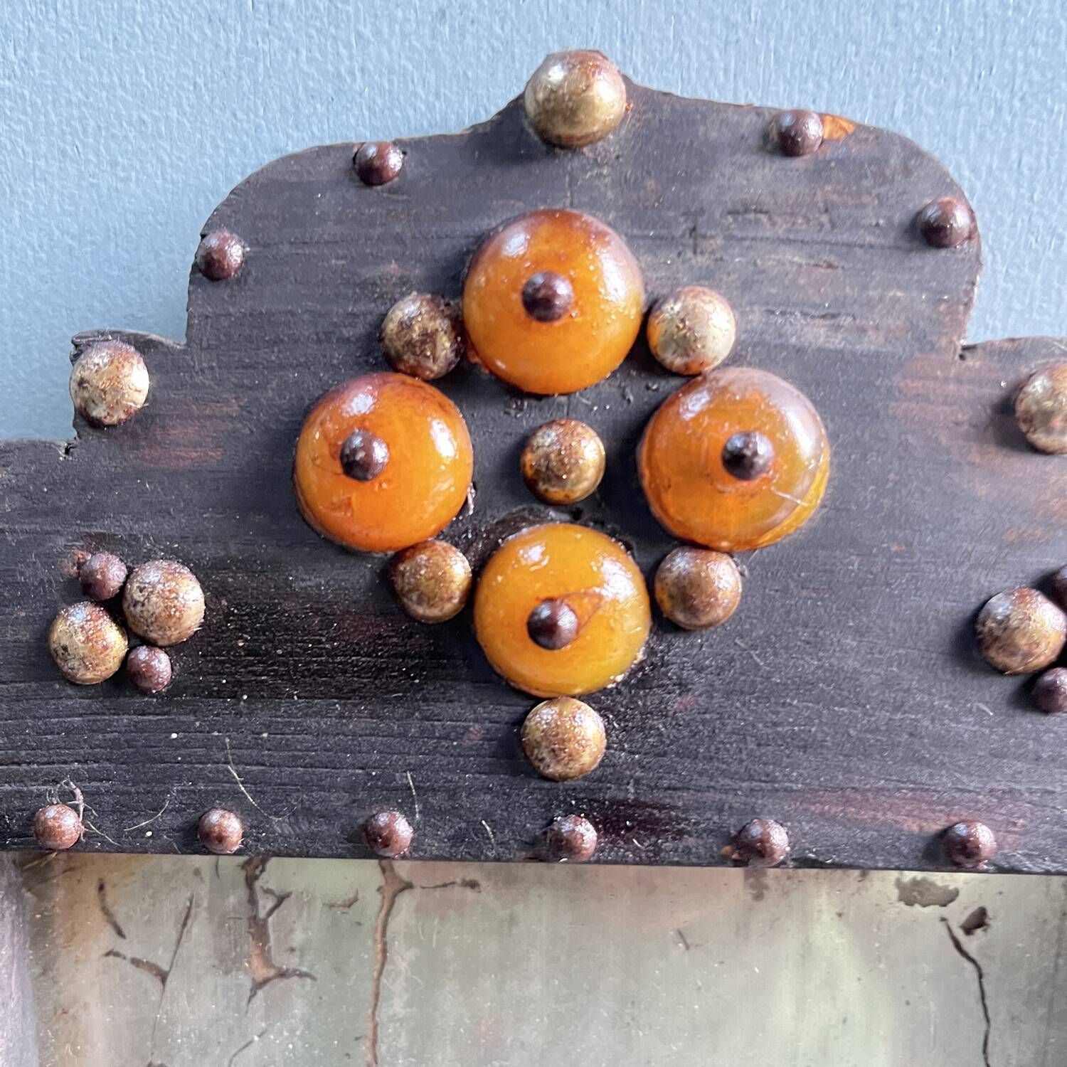 Antique wooden studded mirror