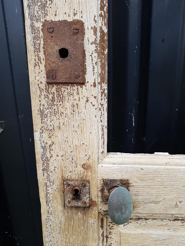Ancient paneled solid oak door with 3 windows