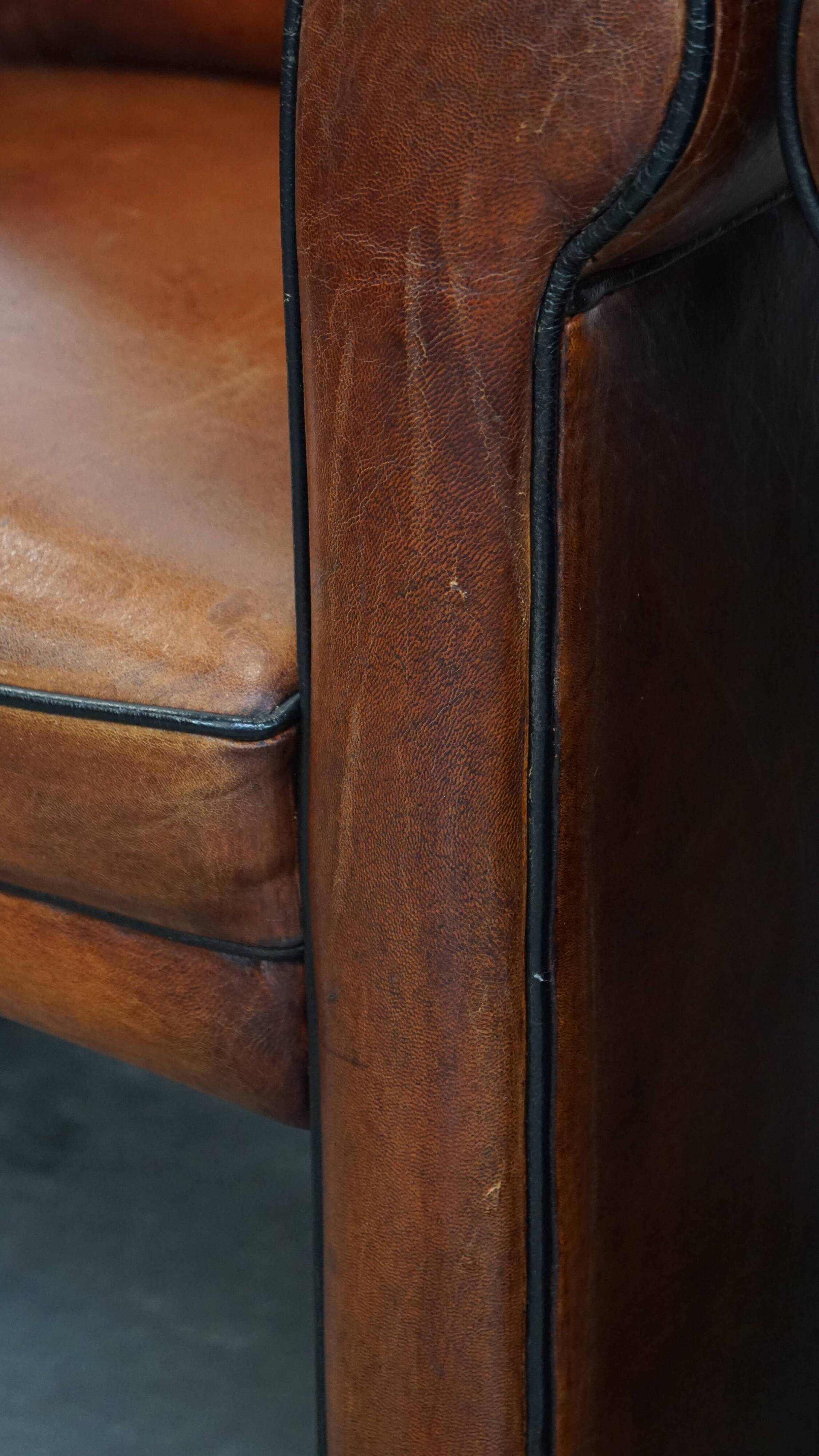 Vintage set of 4 sheepskin leather dining chairs on castors