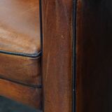 Vintage set of 4 sheepskin leather dining chairs on castors