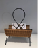 Rattan and black lacquered metal magazine rack