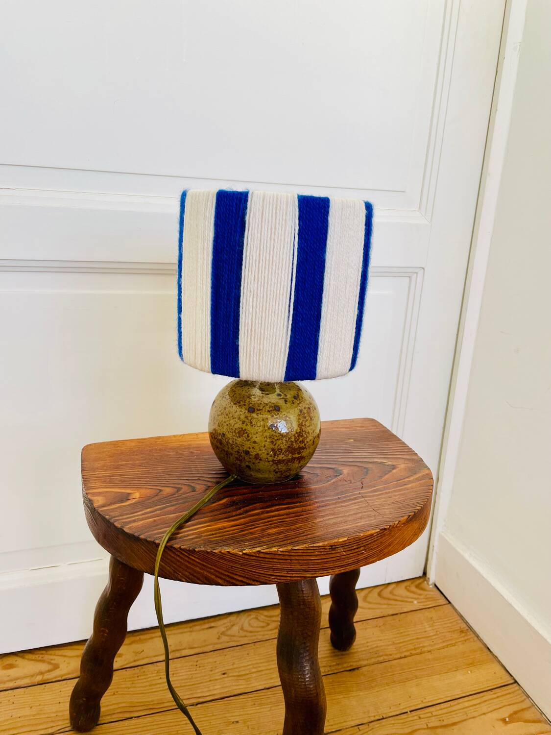 Vintage table lamp with pyrite sandstone base and striped wool lampshade