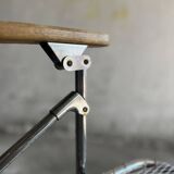 Pair of vintage silver aluminum wire folding chairs with wooden armrests — industrial minimalist