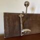 Patinated wood and metal coat rack from the 1950s.