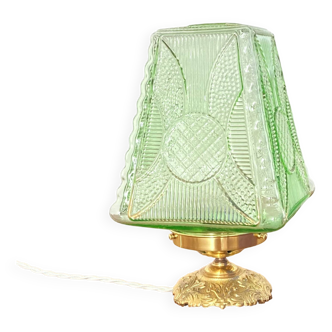 Table lamp with its old green glass globe and its brass base desk lamp