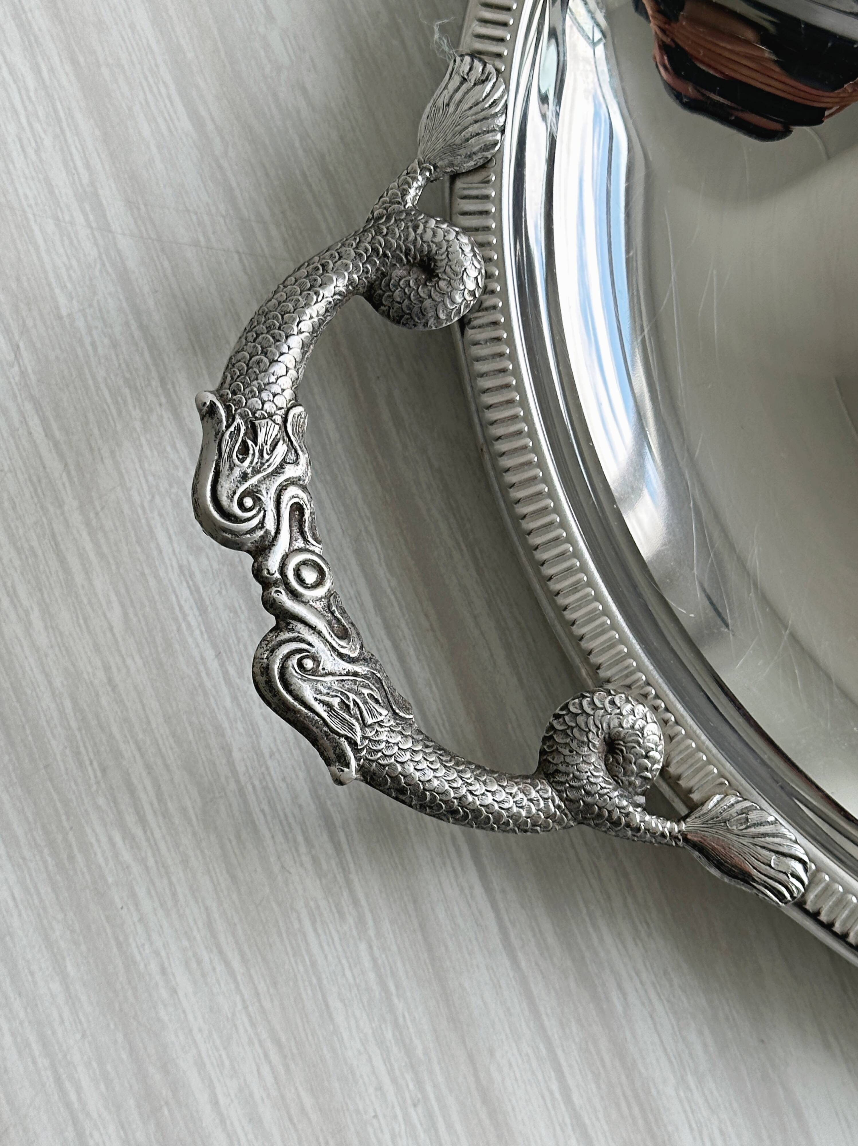 Vintage silver-plated metal serving tray with compartments.
