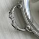 Vintage silver-plated metal serving tray with compartments.