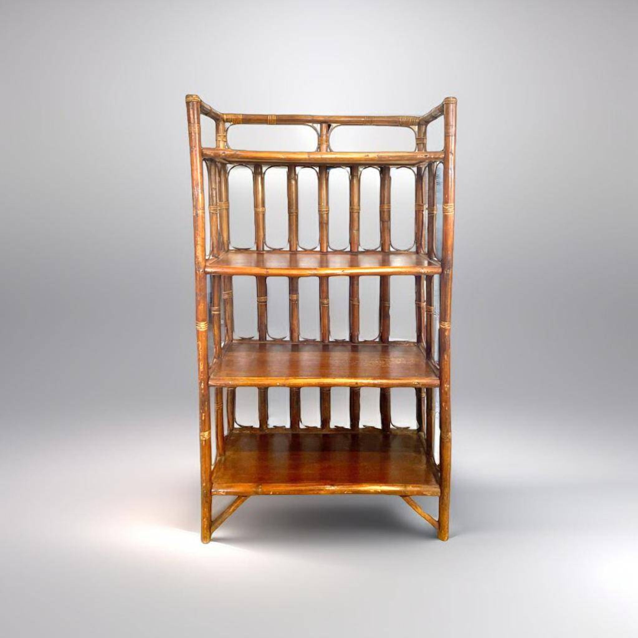 Shelf on rattan and bamboo legs from the 70s