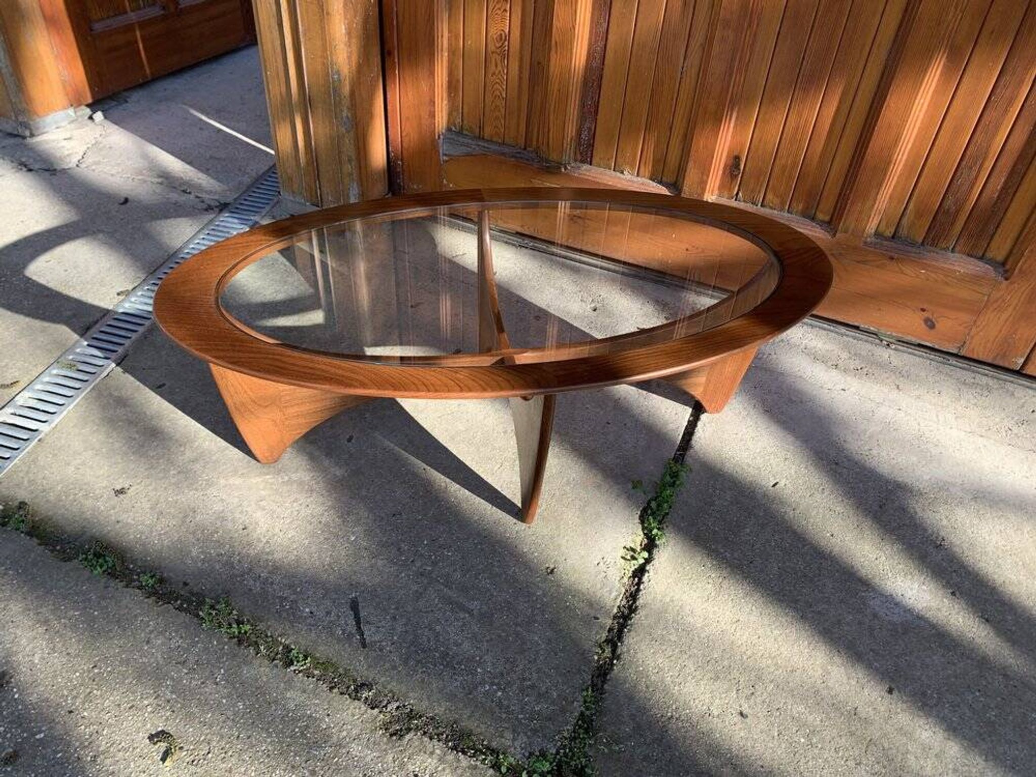 Astro oval coffee table in brown teak with glass top — Victor Wilkins, G-Plan (1960s)