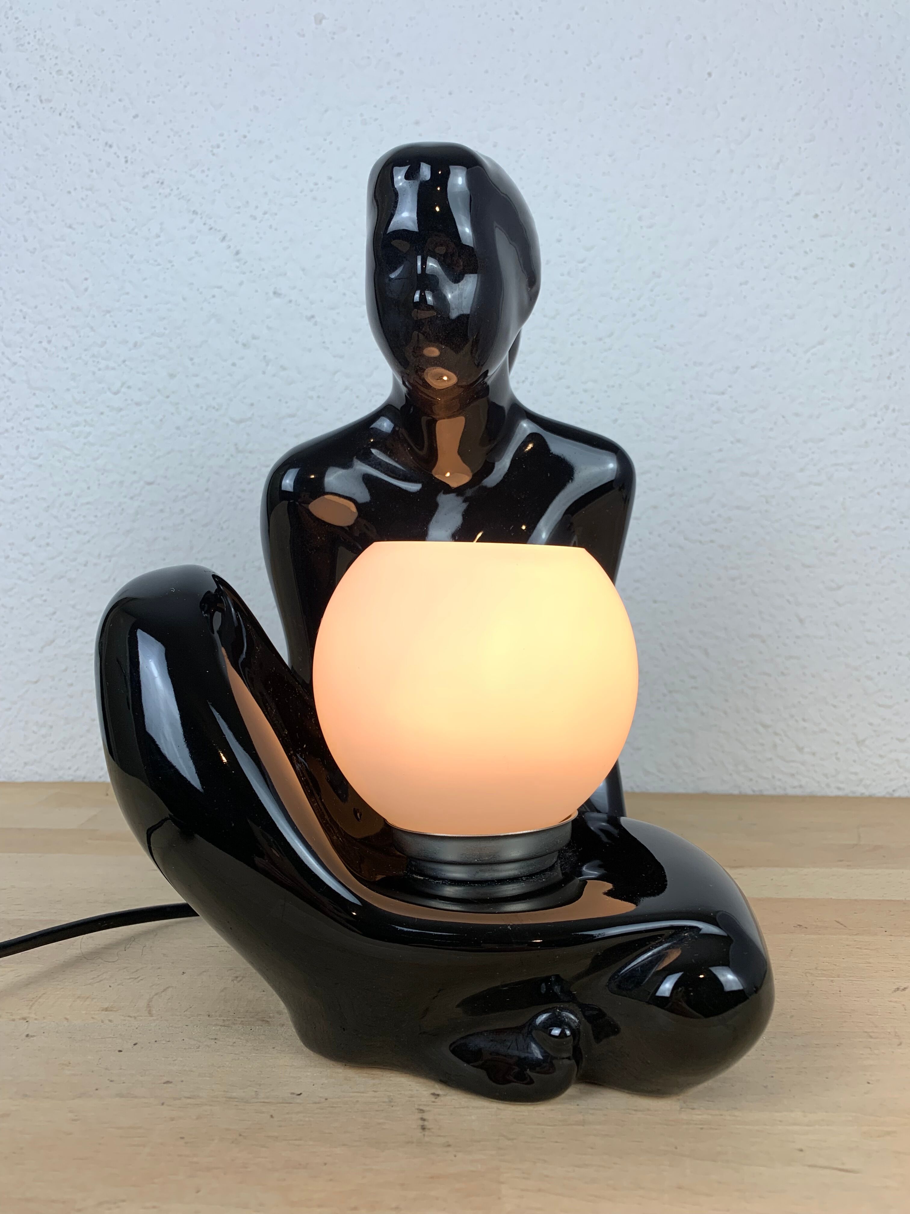 Black ceramic lamp and opal globe