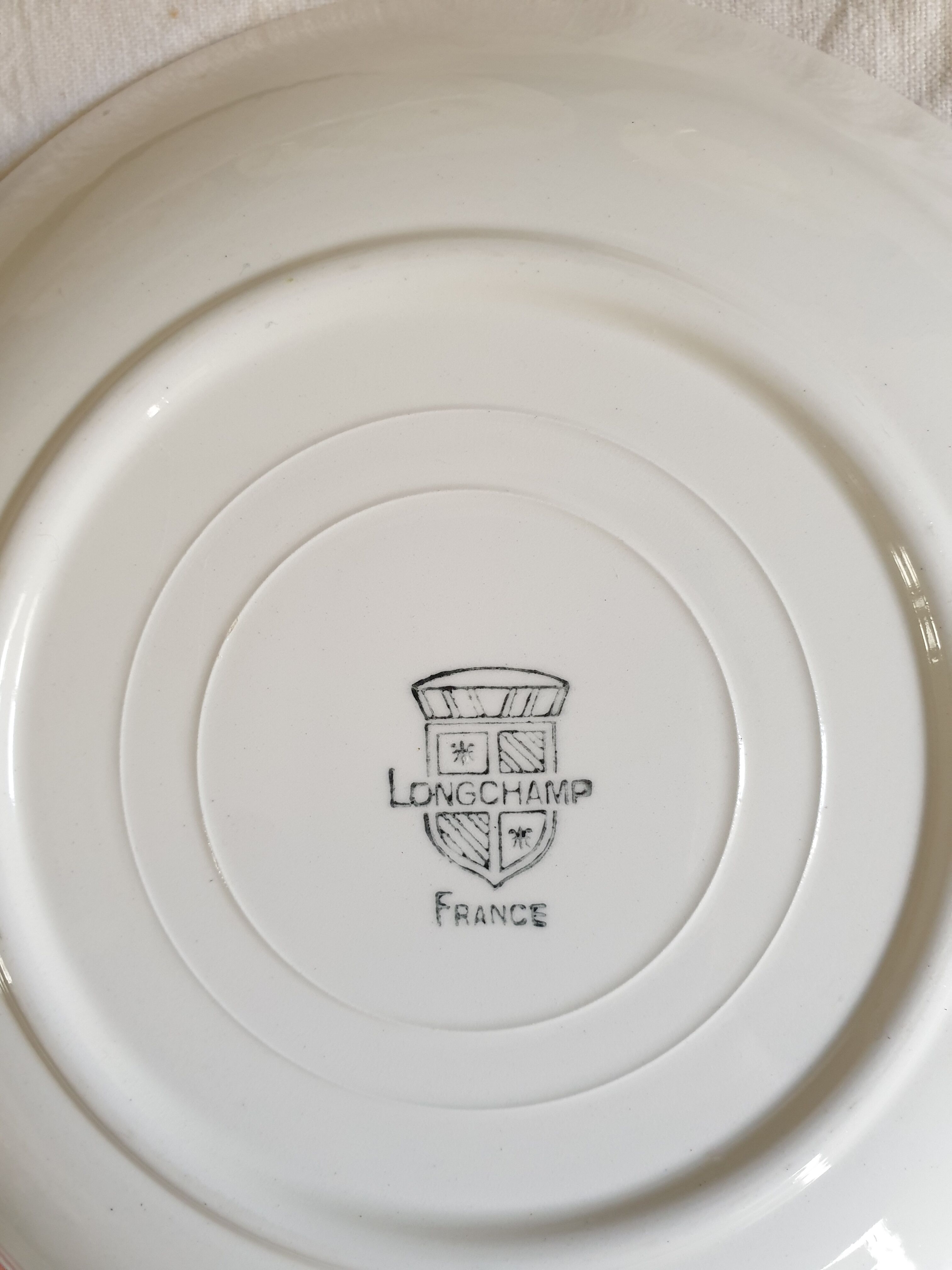 Suite of 9 plates Longchamp 60's