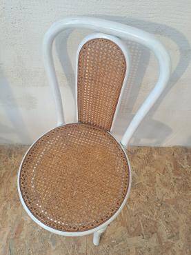 4 white rattan and cane chairs