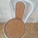 4 white rattan and cane chairs