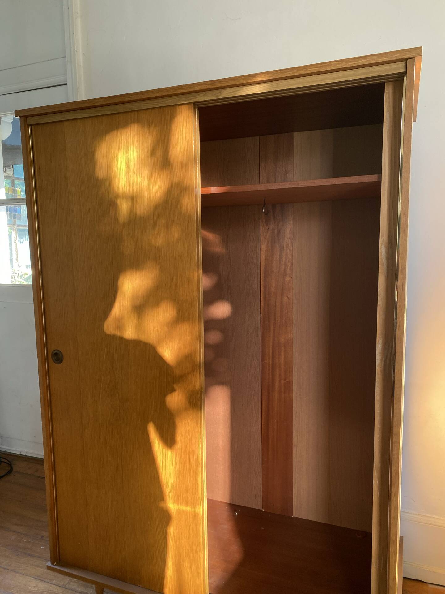 Large vintage Scandinavian wardrobe with two sliding doors.