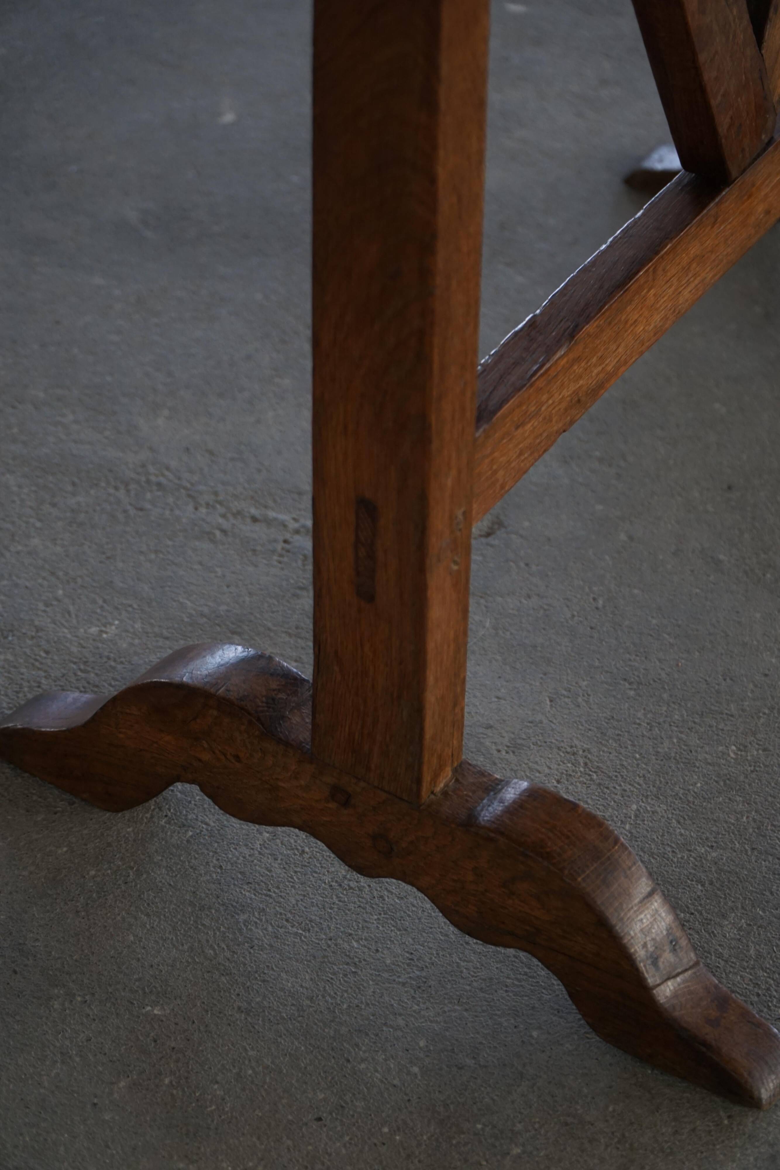 19th-century French round wine table with an adjustable top and floral textile surface.