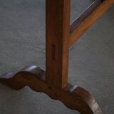 19th-century French round wine table with an adjustable top and floral textile surface.