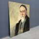 Old portrait of man painted on wooden panel
