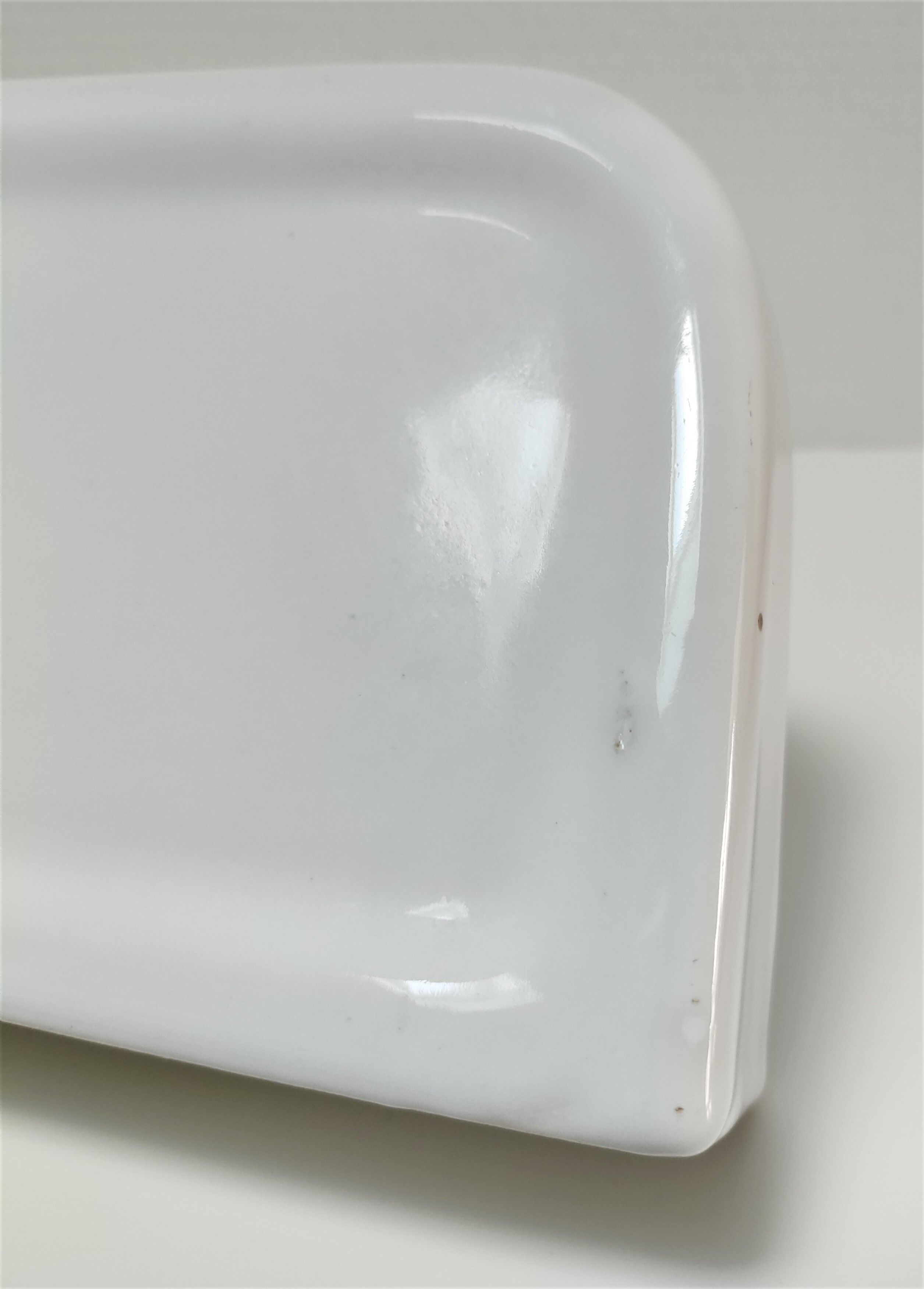 Vintage white glazed ceramic wall shelf
