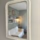 Antique Louis-Philippe mirror with pearls and shells, white patina.