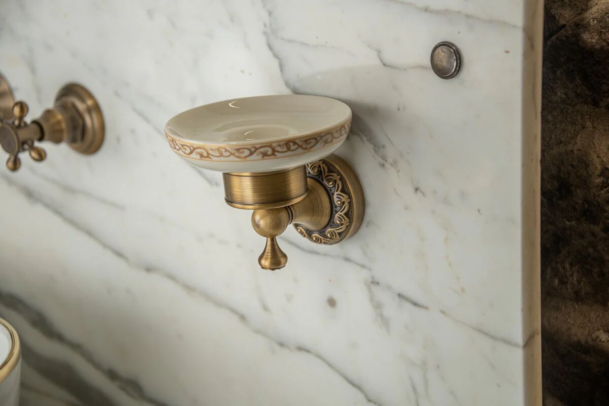 Antique washbasin cabinet from 1928 in wood and marble with a lighted mirror.