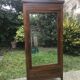 Armoire bonnetière Art Déco à miroir biseauté 1930/1940