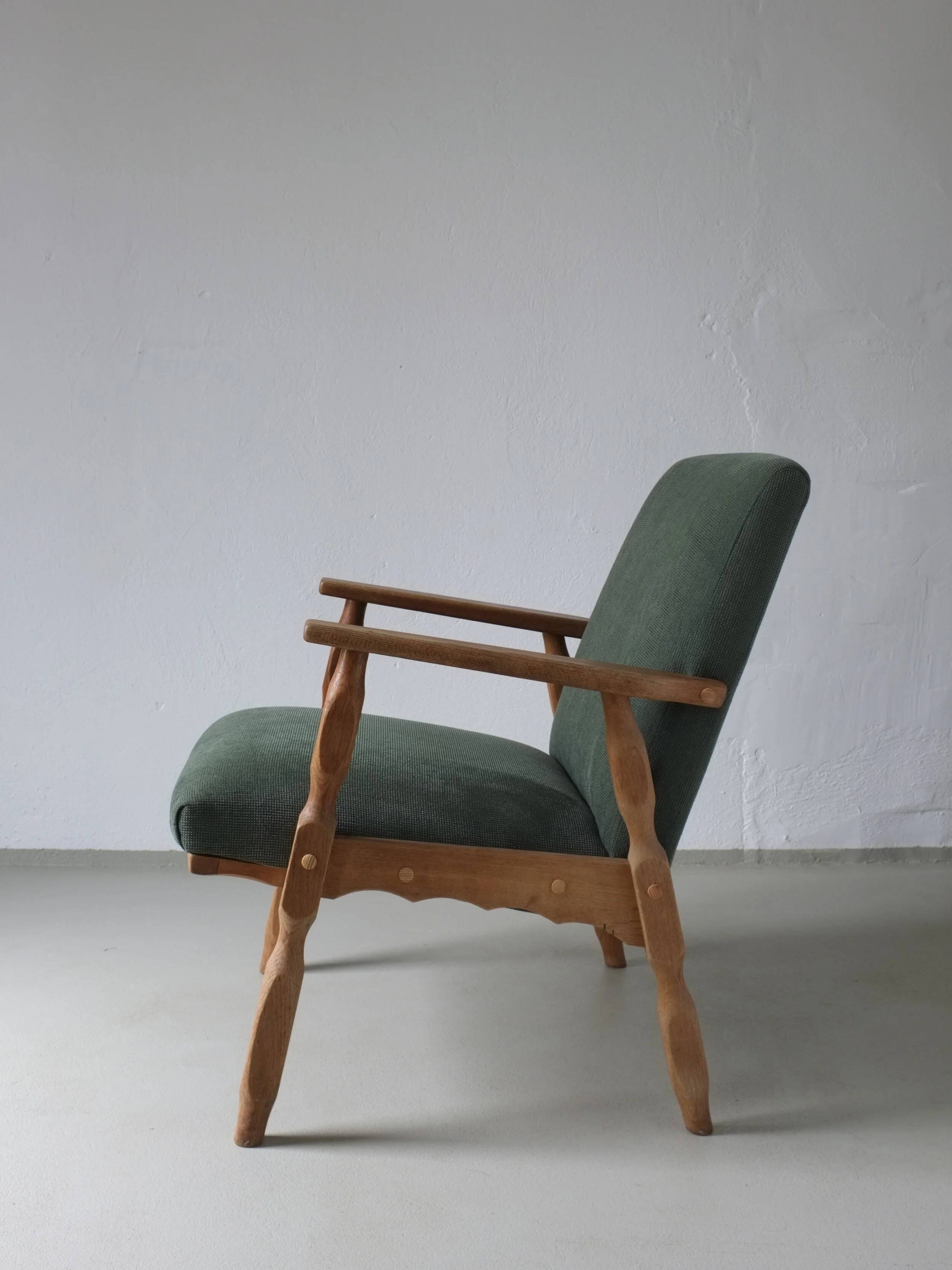 Henning Kjaernulf oak scalloped lounge chair | Denmark | 1950s