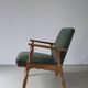 Henning Kjaernulf oak scalloped lounge chair | Denmark | 1950s