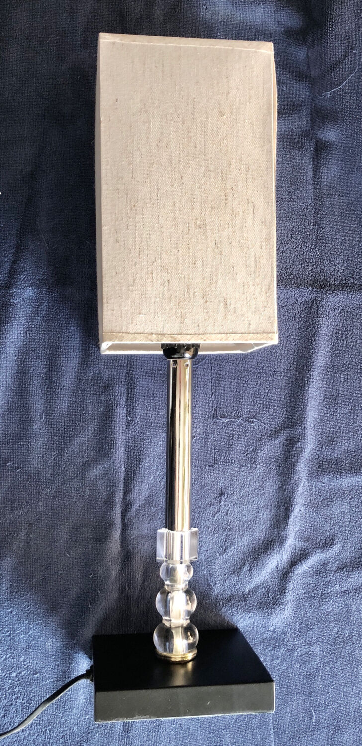 Silver floor lamp with a straight shade.
