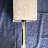 Silver floor lamp with a straight shade.