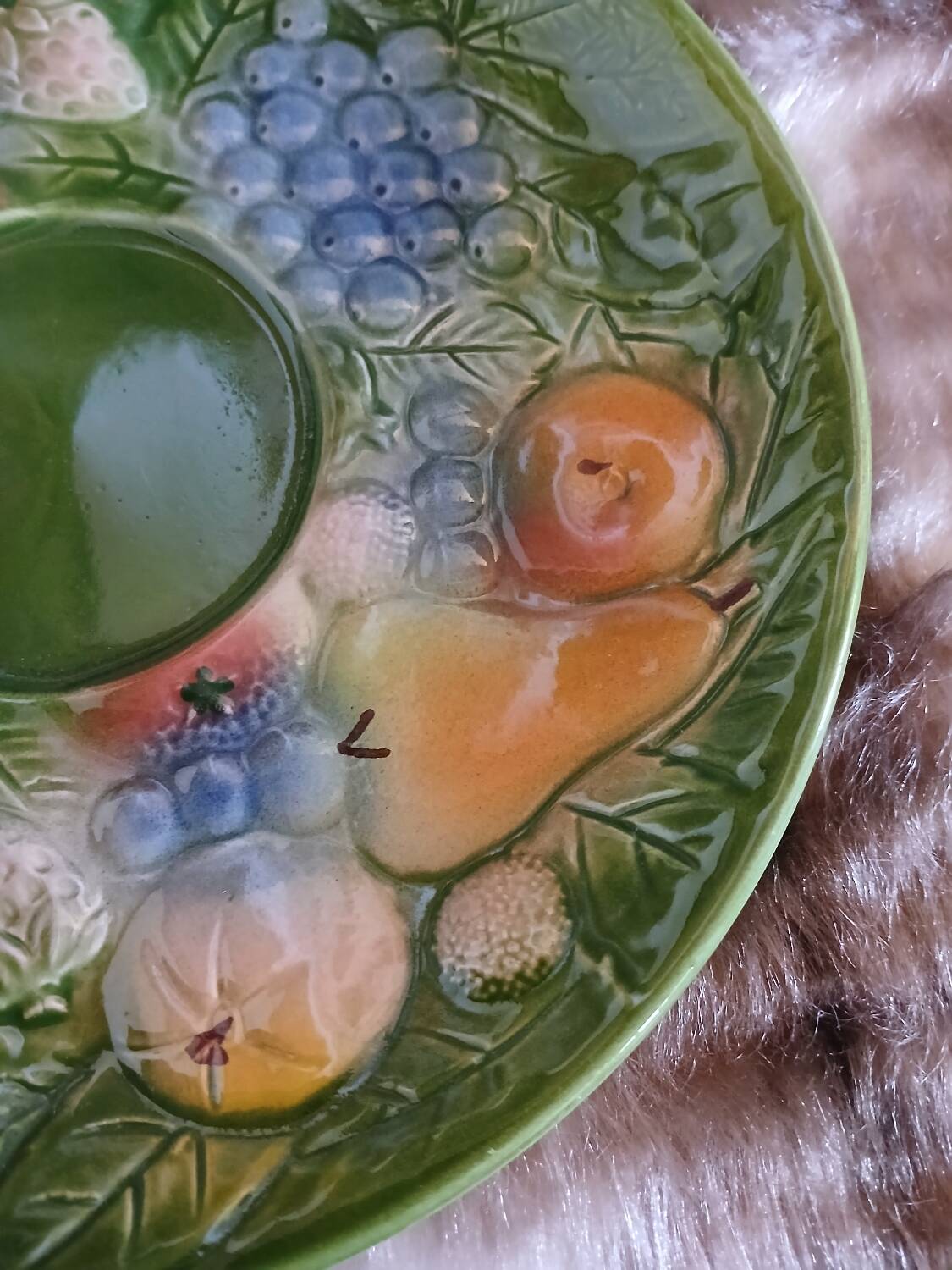 Antique cup and saucer in slipware.
