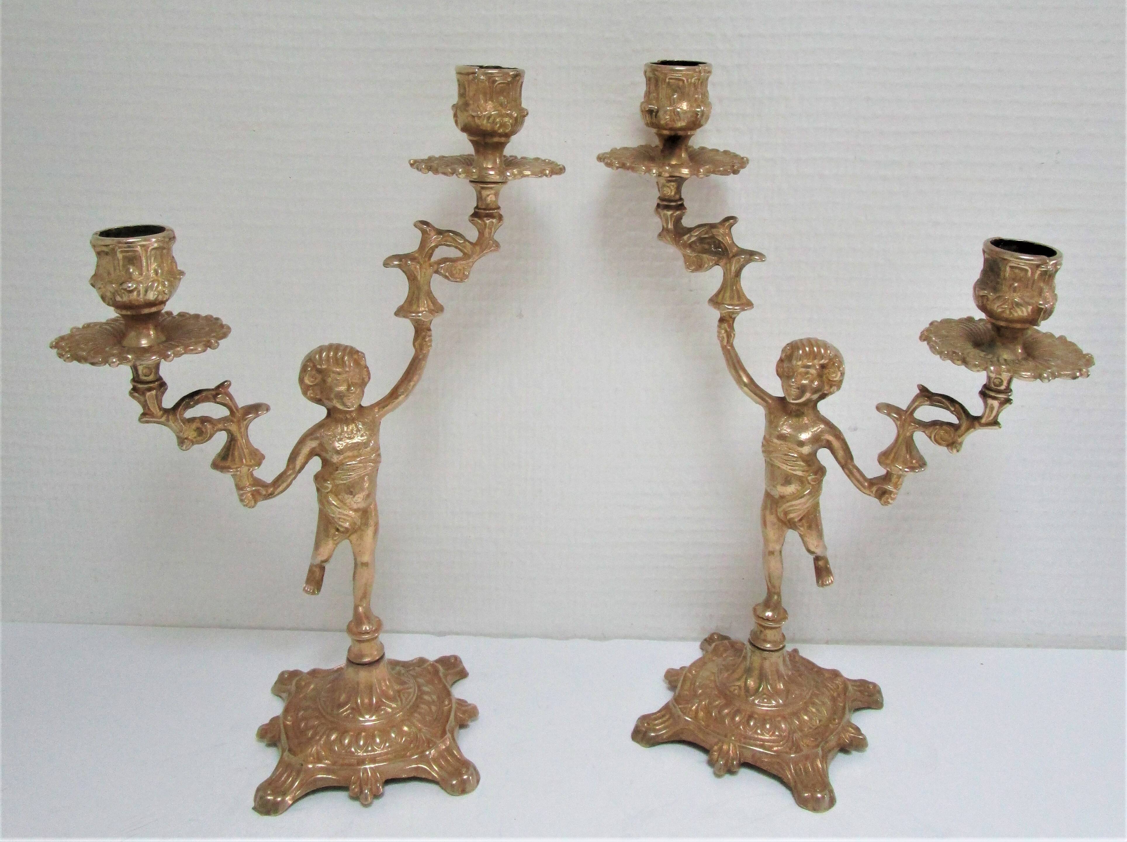 Pair of vintage golden brass cherub candlesticks