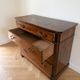 Antique solid wood chest of drawers with four drawers.