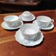 Set of 4 Limoges porcelain cups and saucers.
