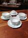 Set of 4 Limoges porcelain cups and saucers.