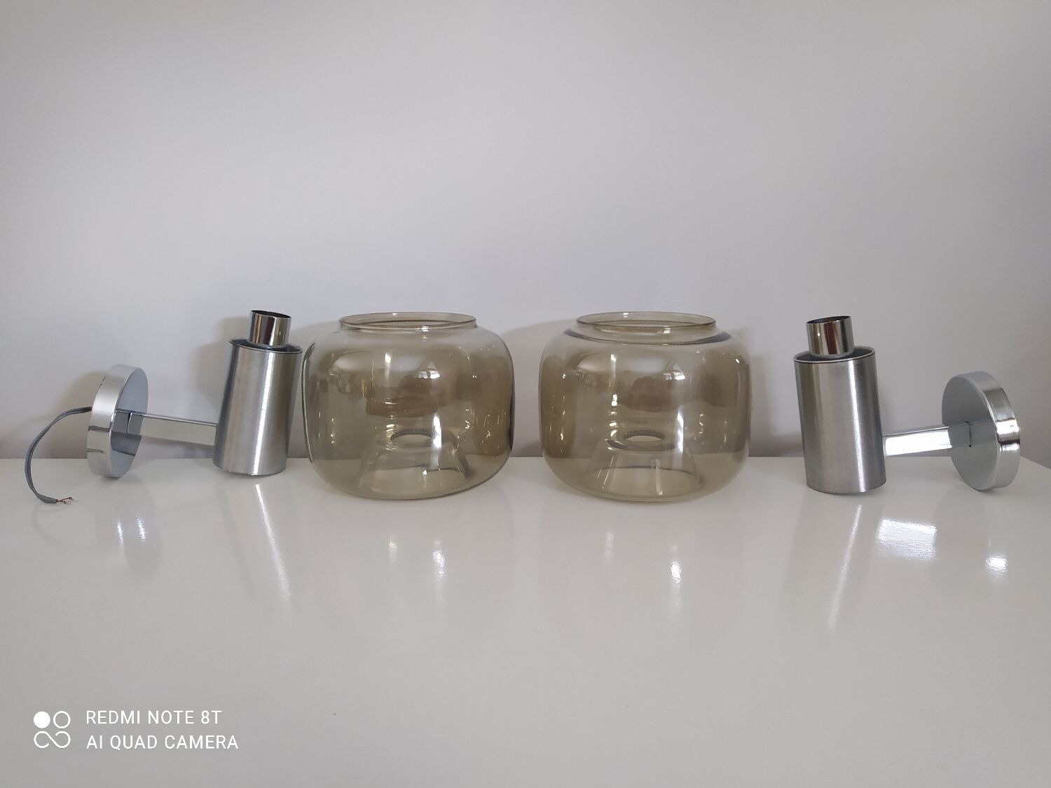 Pair of vintage chrome wall lights with smoked glass globe