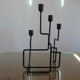 Modernist candle holder in black lacquered metal 1990