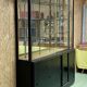 Store window with sliding doors in matte black patinated oak - 30s