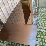 Scandinavian extendable dining table made of solid wood and rosewood effect.