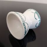 Old porcelain diabolo egg cup decorated with green frieze and garlands