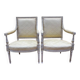 Paire de fauteuils de style Louis XVI en bois patiné