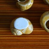 Lot of 12 enamelled sandstone snail shells