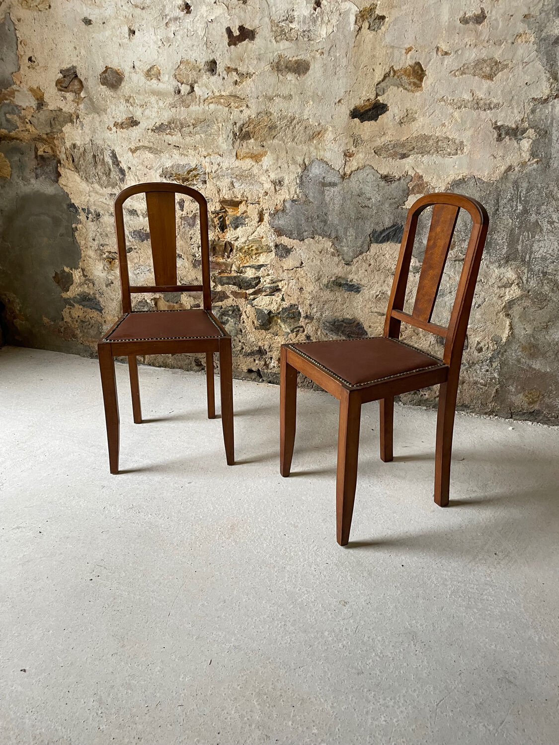 Set of 2 wooden chairs with studded leather.