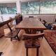 Set table, 4 chairs and a brutalist bench in the Regain style.