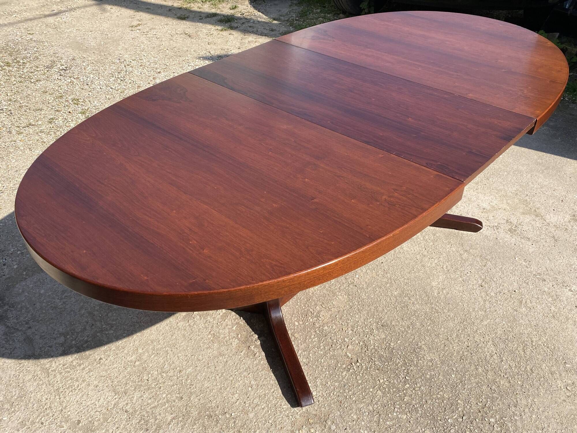 Baumann round oval extendable Scandinavian table in rosewood with 2 extensions.