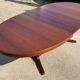 Baumann round oval extendable Scandinavian table in rosewood with 2 extensions.