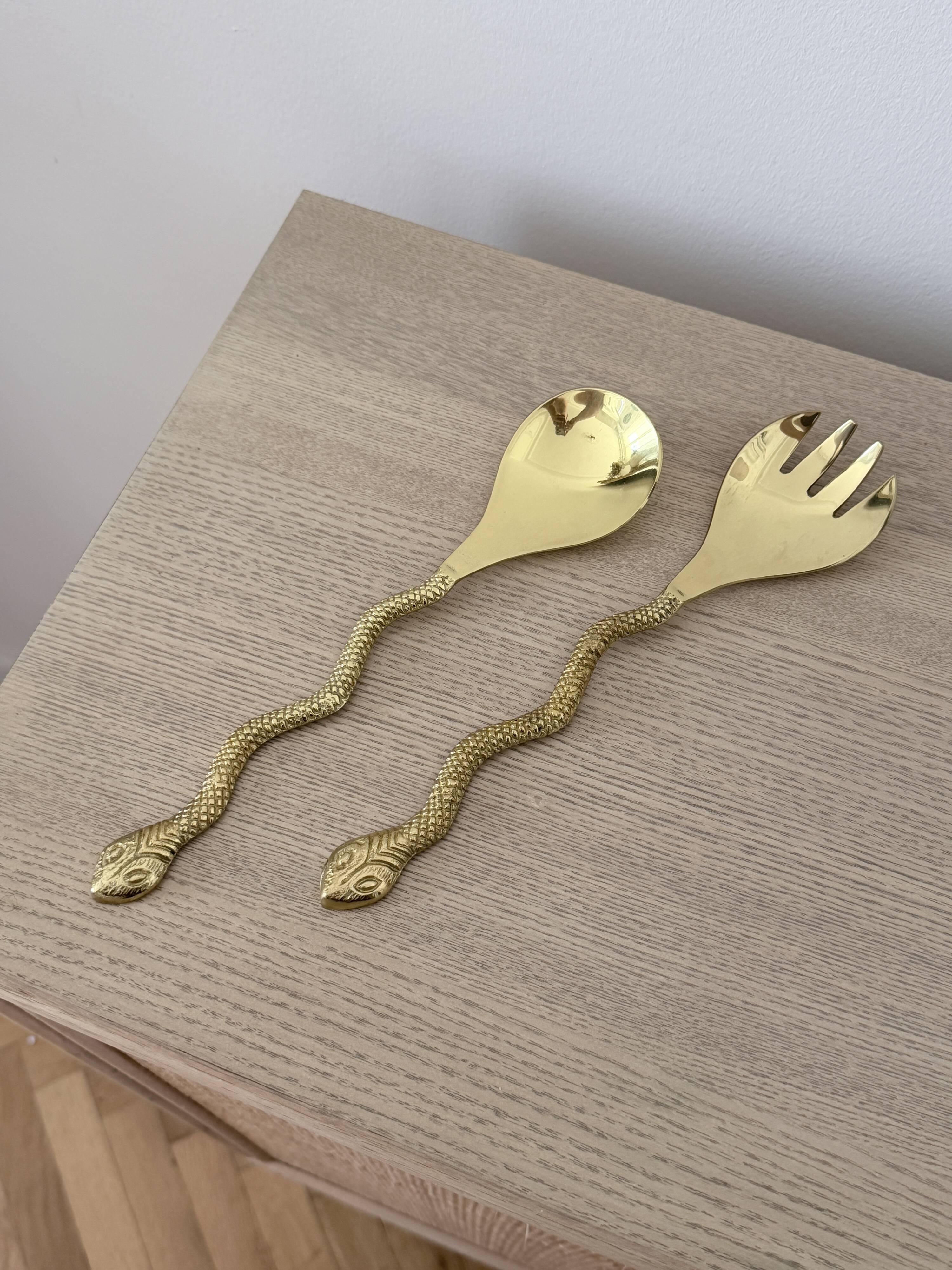 Gold metal snake salad serving set